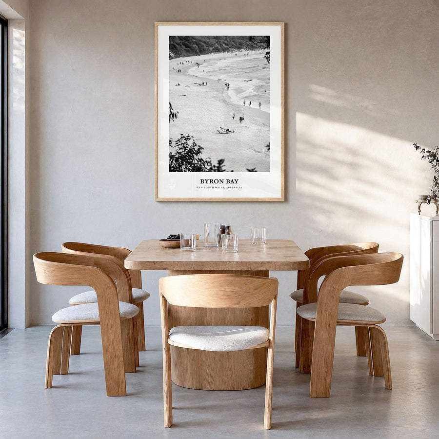 Byron Bay Classic No 1 Poster in a natural wood frame, hanging in a dining room