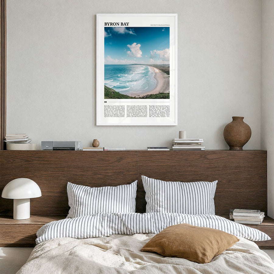 Byron Bay Travel No 1 Poster in a white wood frame, hanging in a bedroom