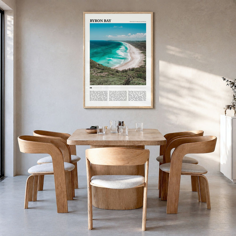 Byron Bay Travel No 2 Poster in a natural wood frame, hanging in a dining room