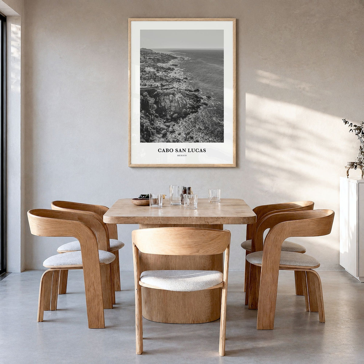 Cabo San Lucas Classic Poster in a natural wood frame, hanging in a dining room