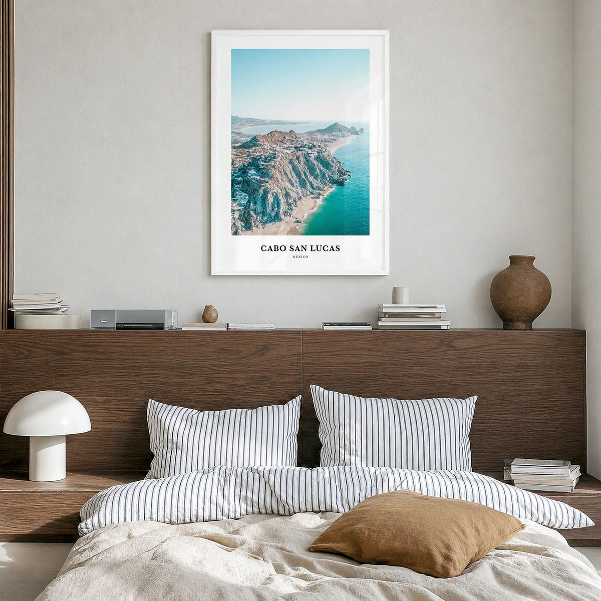Cabo San Lucas Classic Poster in a white wood frame, hanging in a bedroom