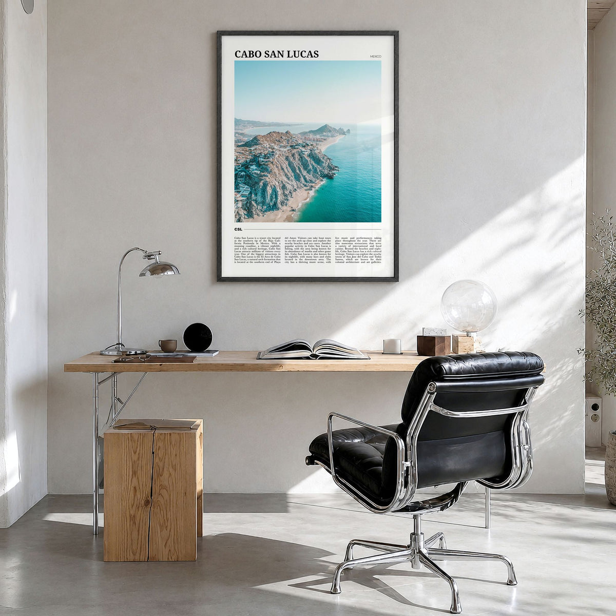Cabo San Lucas Travel Poster in a black wood frame, hanging in a bright home office