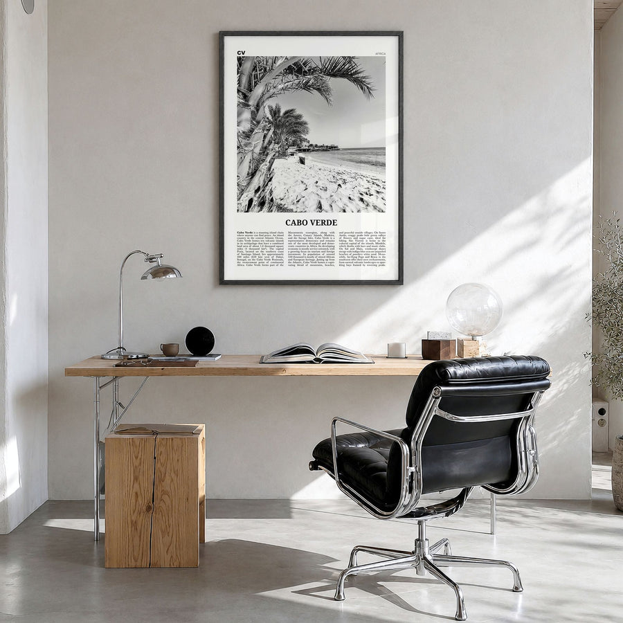 Cabo Verde Newspaper Poster in a black wood frame, hanging in a bright home office