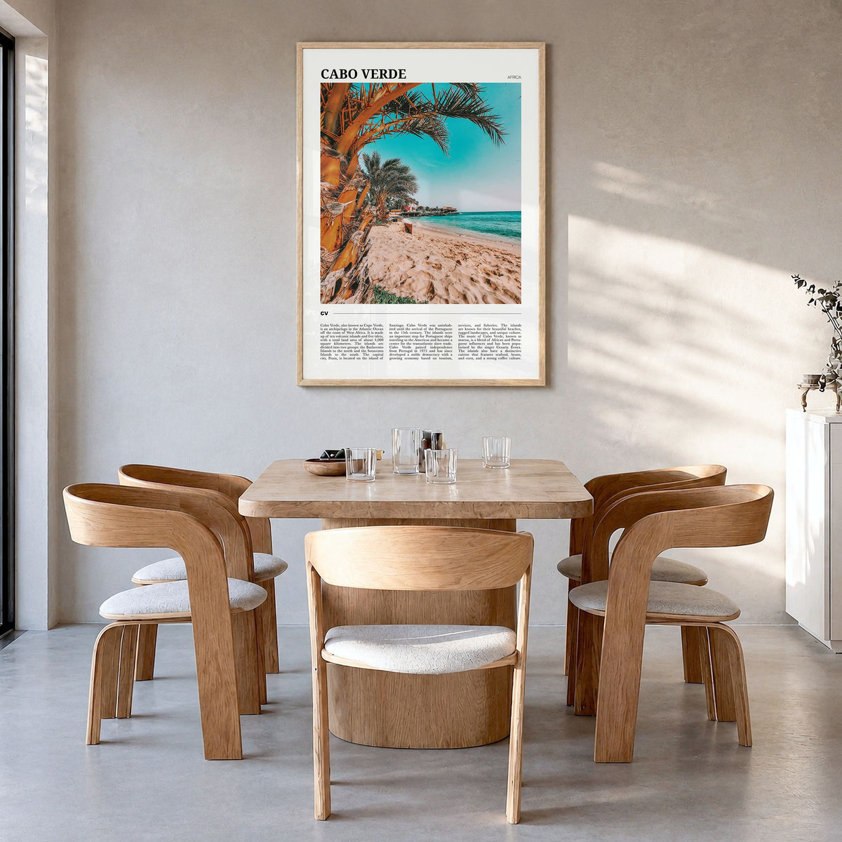 Cabo Verde Travel Poster in a natural wood frame, hanging in a dining room