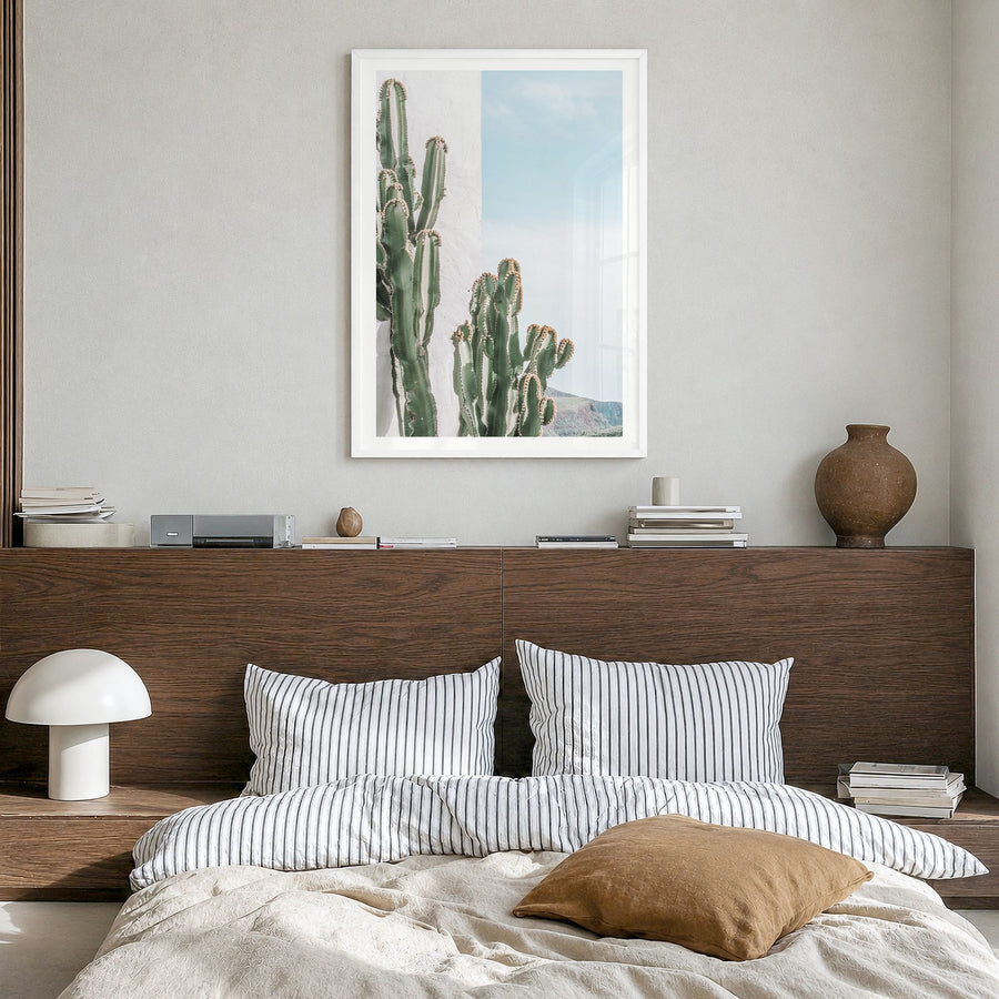 Cactus Photo No 1 Poster in a white wood frame, hanging in a bedroom, white border