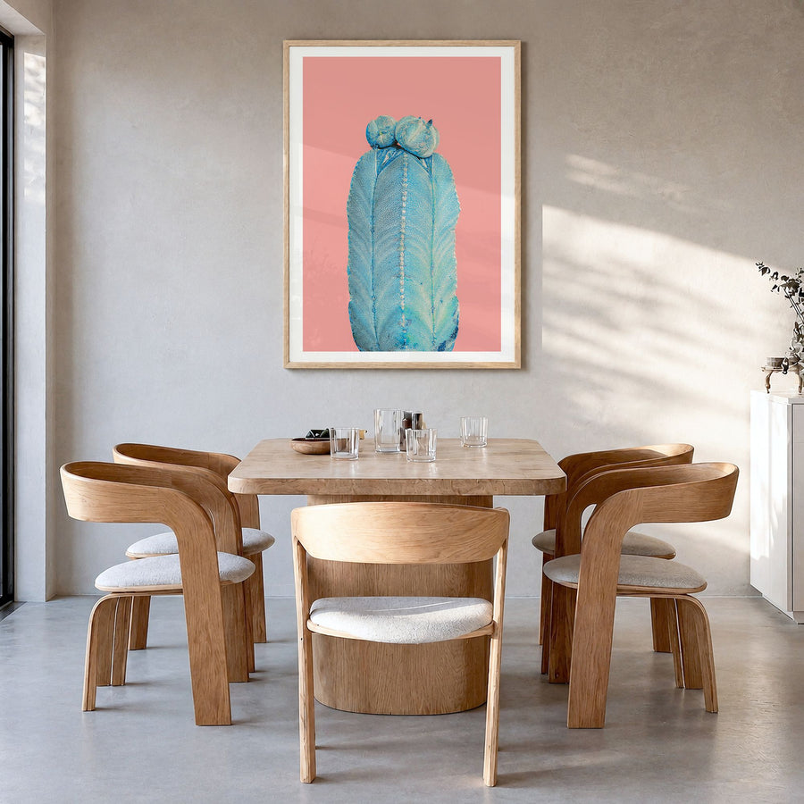 Cactus Photo No 5 Poster in a natural wood frame, hanging in a dining room, white border