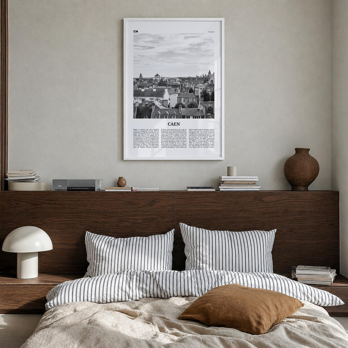 Caen no. 1 black & white newspaper poster of France – vertical wall art in white wood frame, hanging on wall