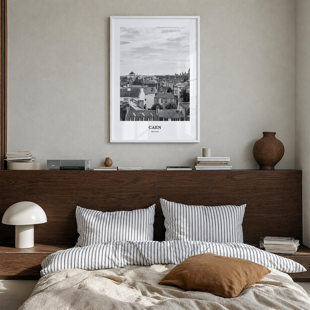 Caen no. 2 black & white classic poster of France – vertical wall art in white wood frame, hanging on wall