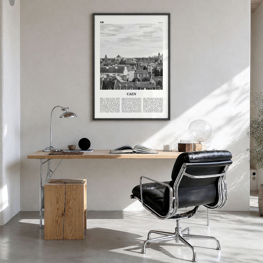 Caen Newspaper No 1 Poster in a black wood frame, hanging in a bright home office