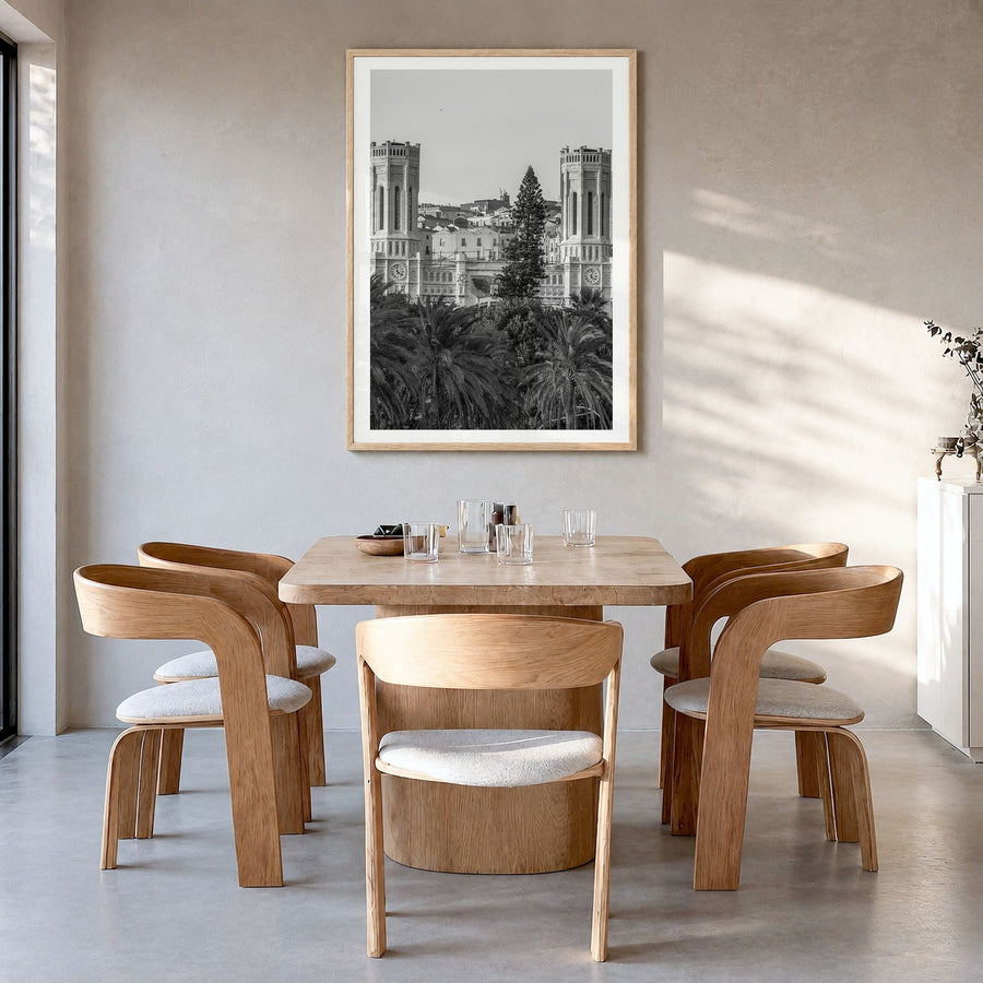 Cagliari Photo Poster in a natural wood frame, hanging in a dining room, white border