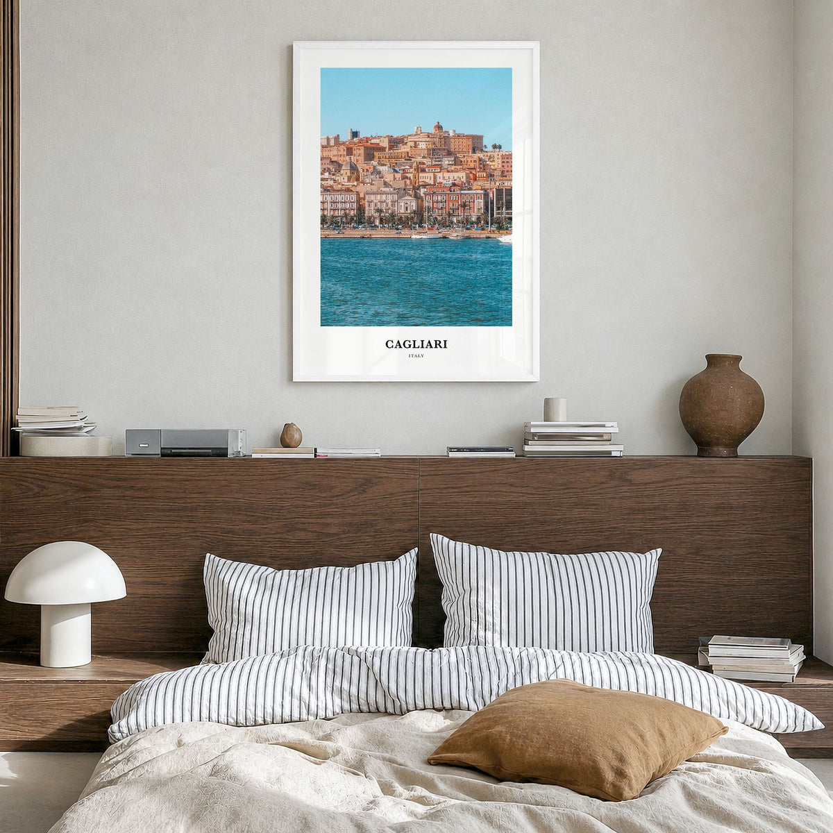 Cagliari Classic Poster in a white wood frame, hanging in a bedroom