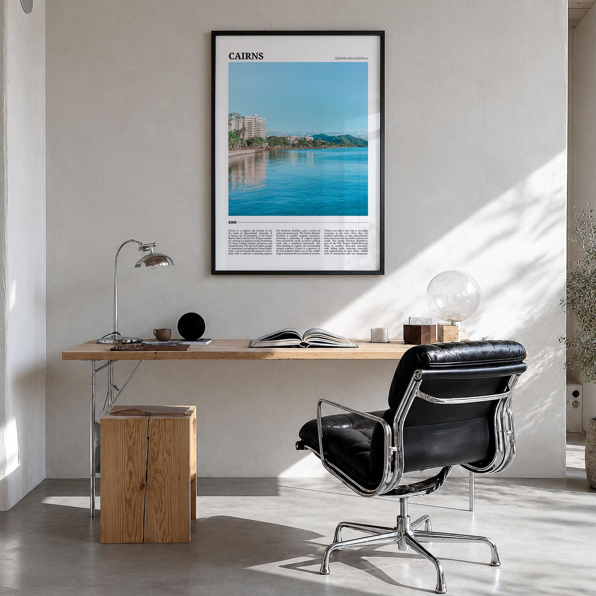 Cairns colorful travel poster of Queensland, Australia – vertical wall art in black wood frame, hanging on wall