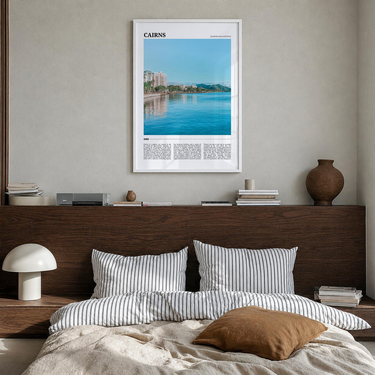 Cairns colorful travel poster of Queensland, Australia – vertical wall art in white wood frame, hanging on wall