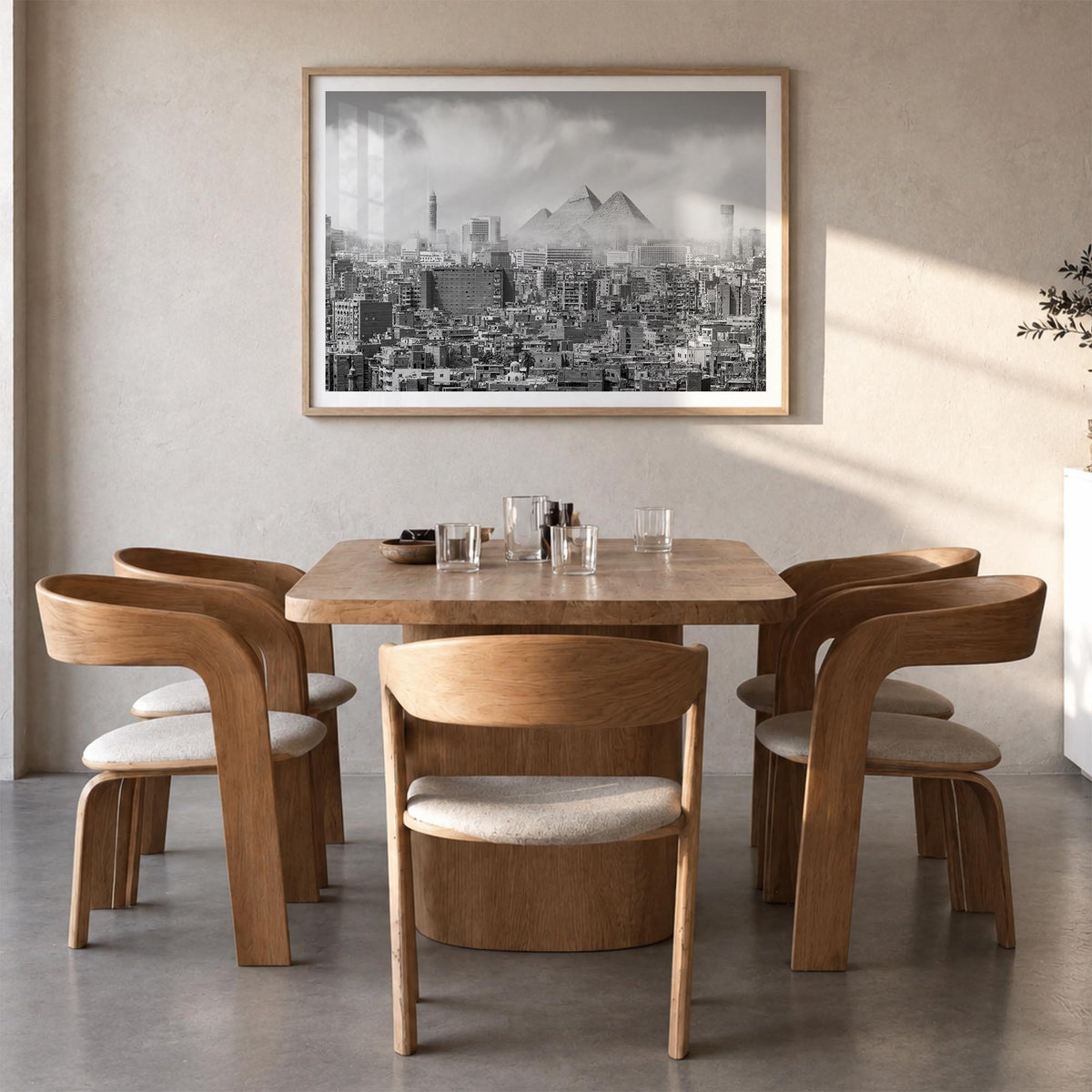 Cairo black & white photo poster of Egypt – horizontal wall art in natural wood frame with white border, hanging on wall