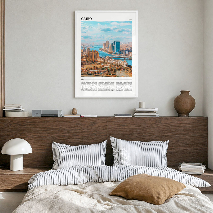 Cairo Travel Poster in a white wood frame, hanging in a bedroom