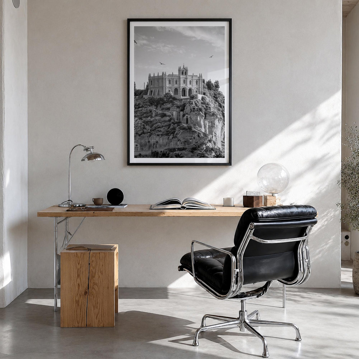 Calabria black & white photo poster of Italy – vertical wall art in black wood frame with white border, hanging on wall