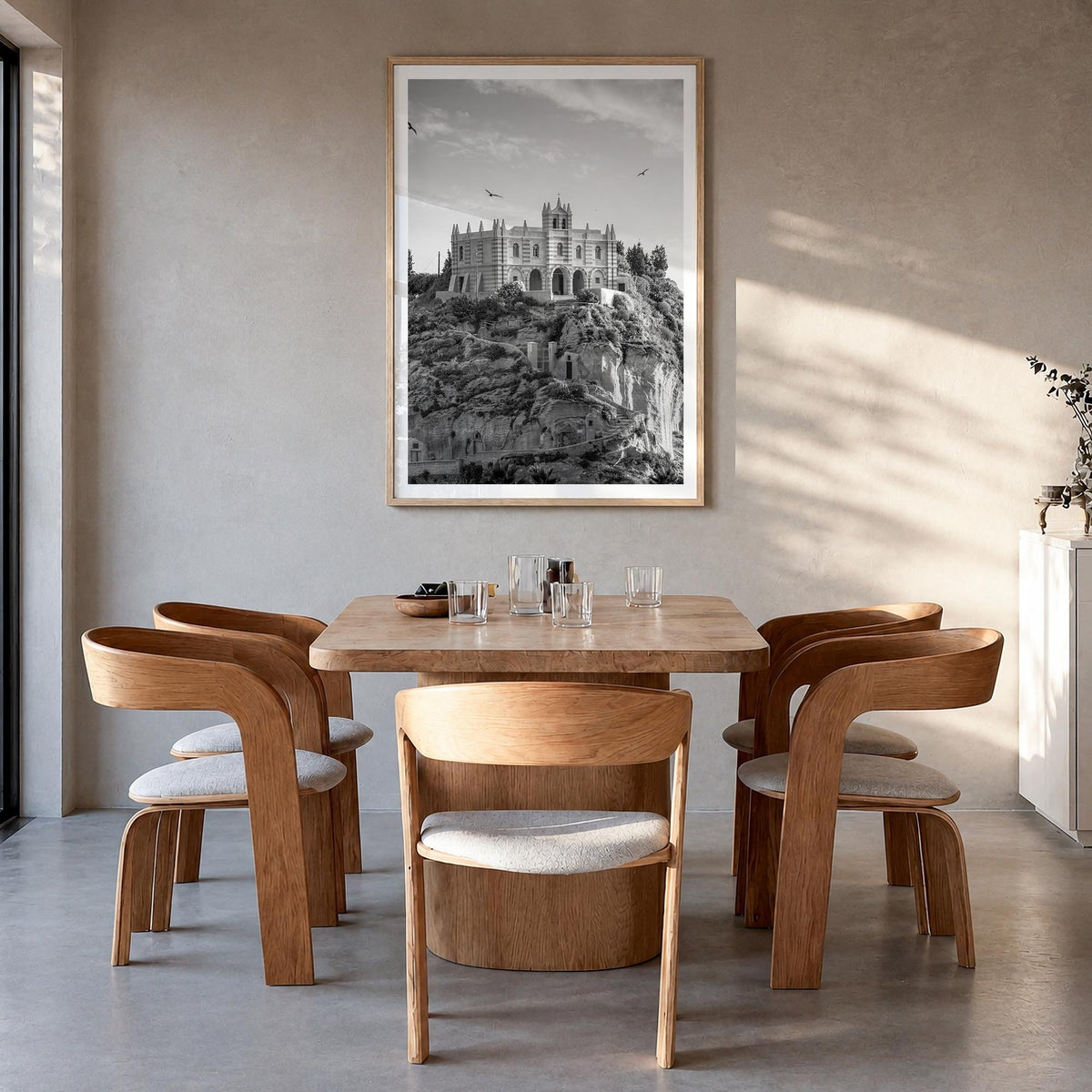 Calabria black & white photo poster of Italy – vertical wall art in natural wood frame with white border, hanging on wall