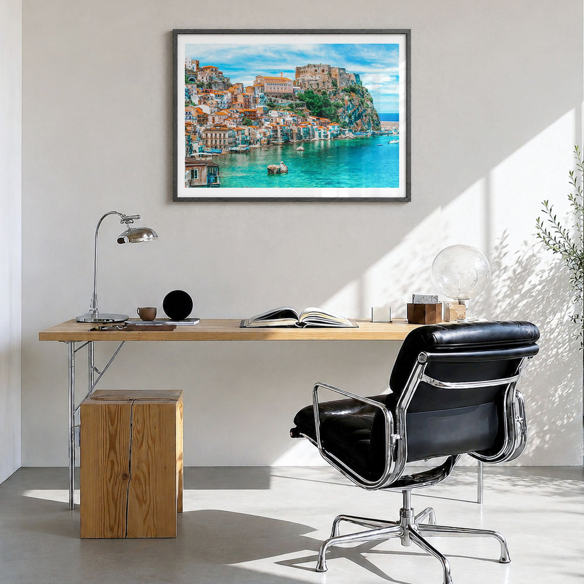 Calabria Photo Poster in a black wood frame, hanging in a bright home office, white border