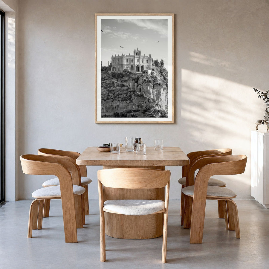 Calabria Photo Poster in a natural wood frame, hanging in a dining room, white border