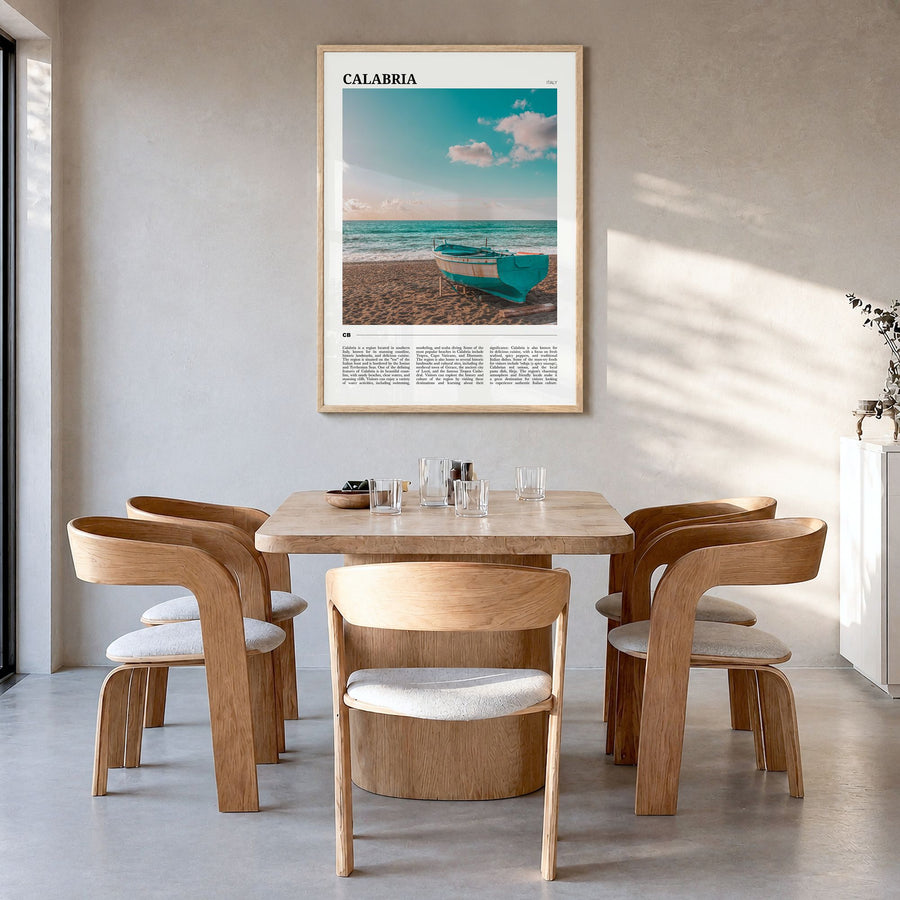 Calabria Travel No 1 Poster in a natural wood frame, hanging in a dining room
