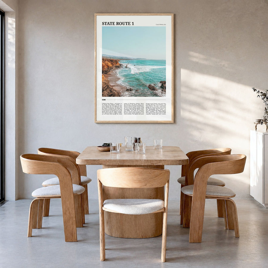 State Route 1 Travel Poster in a natural wood frame, hanging in a dining room