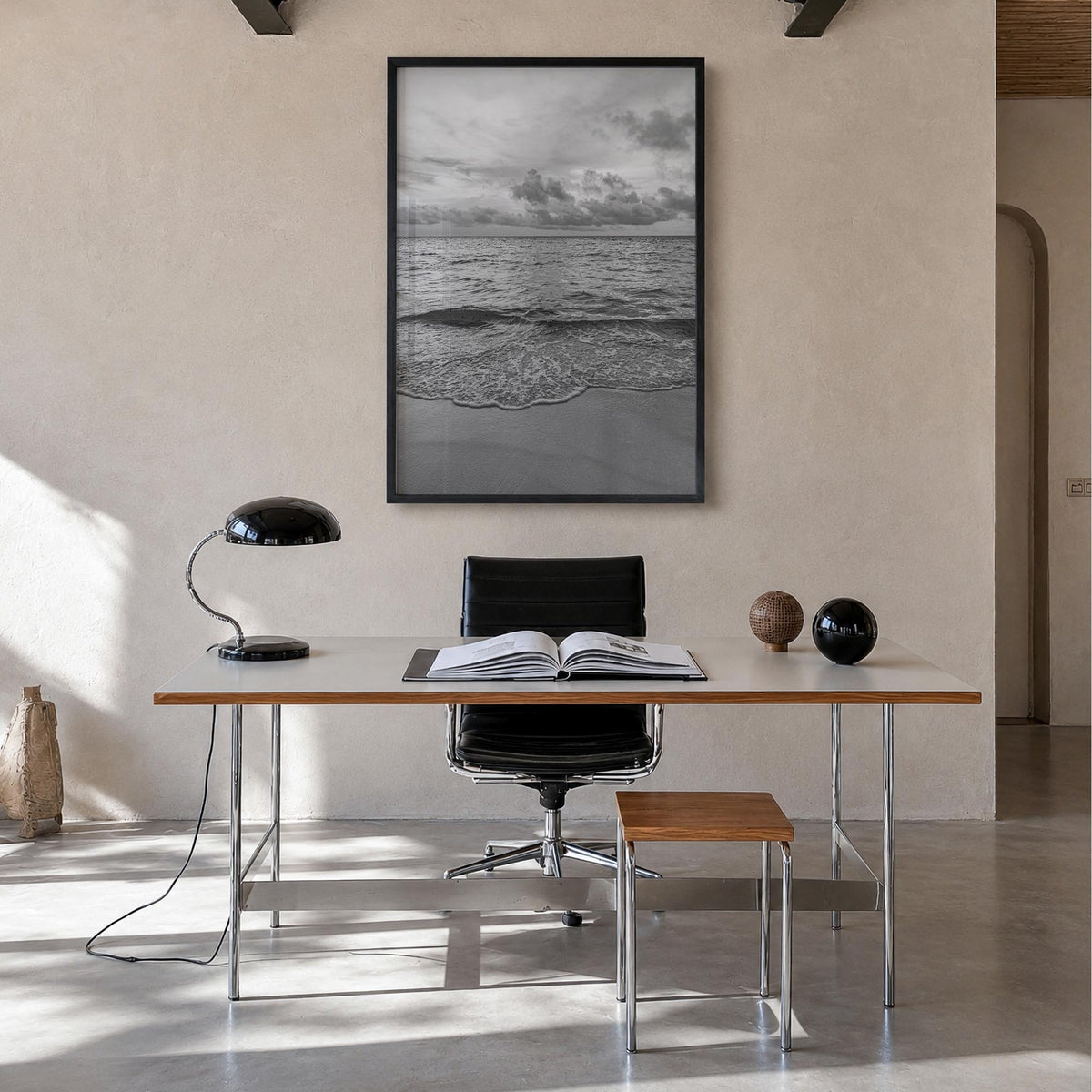 Calm Beach black & white photo poster – vertical wall art in black wood frame, hanging on wall