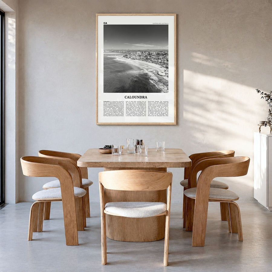 Caloundra Newspaper Poster in a natural wood frame, hanging in a dining room