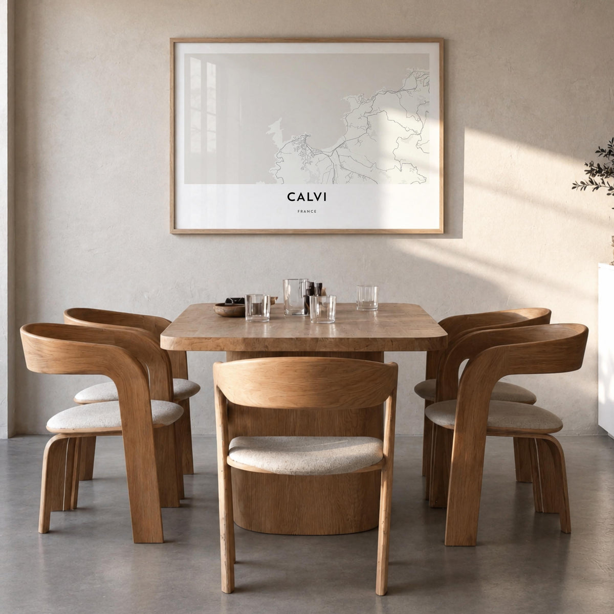 Calvi black & white map poster of France – horizontal wall art in natural wood frame, hanging on wall