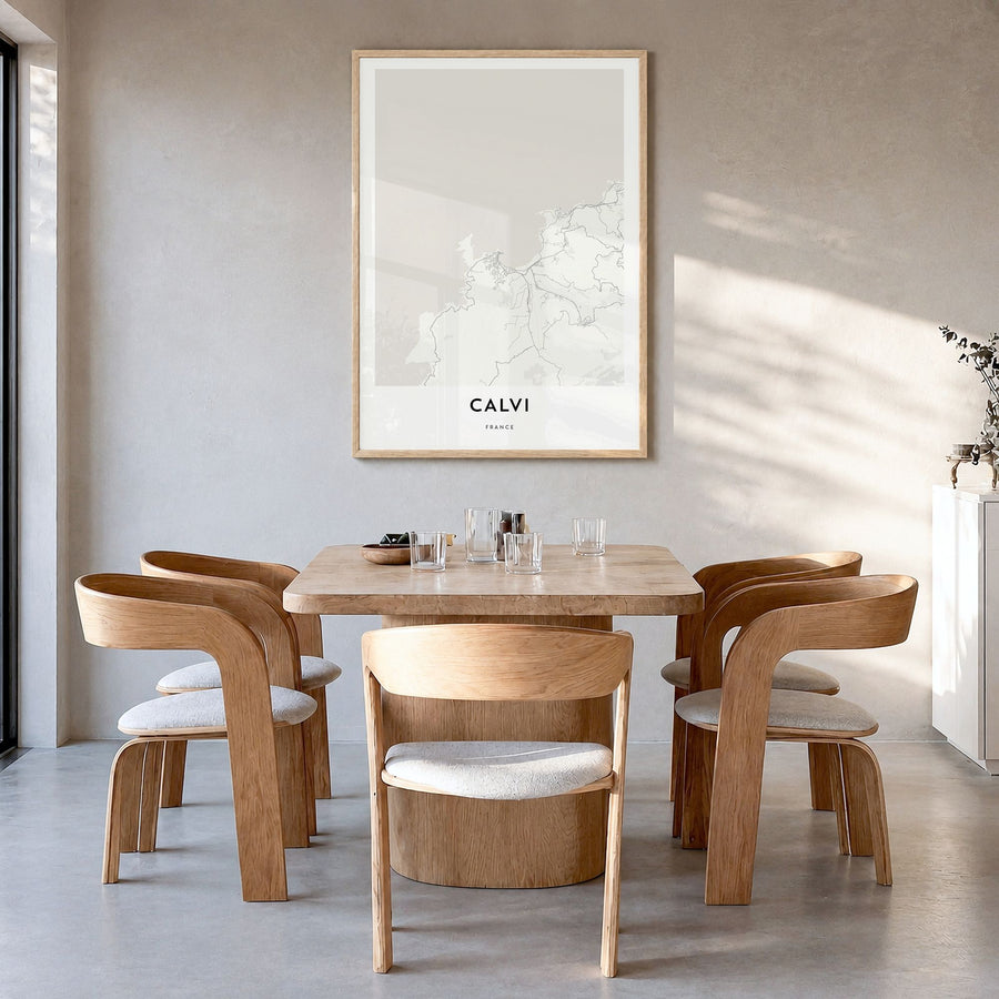 Calvi Map Poster in a natural wood frame, hanging in a dining room