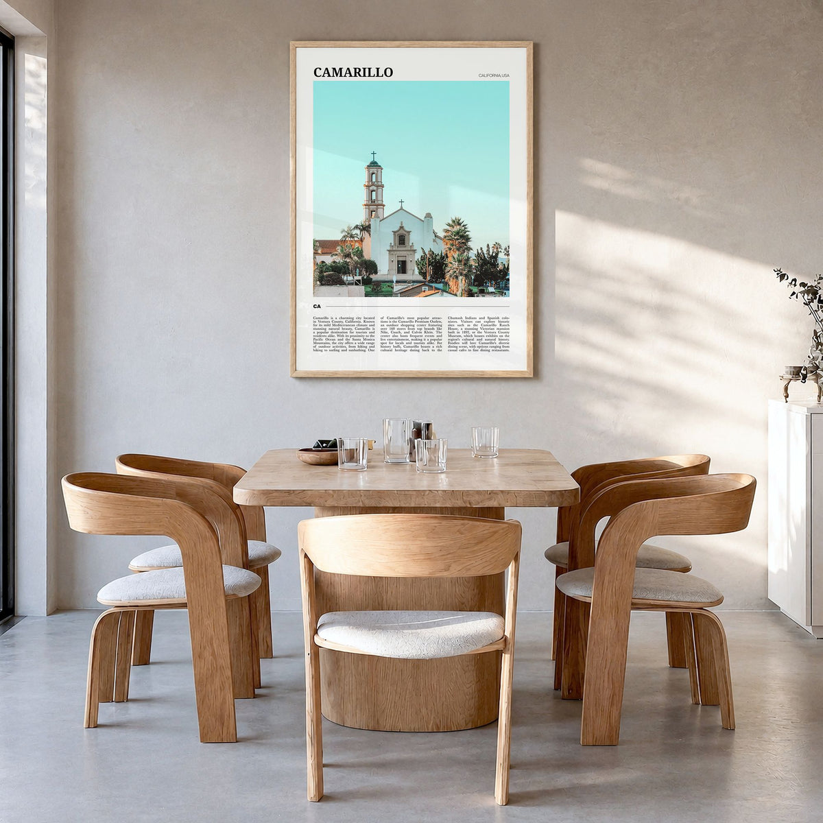 Camarillo Travel Poster in a natural wood frame, hanging in a dining room