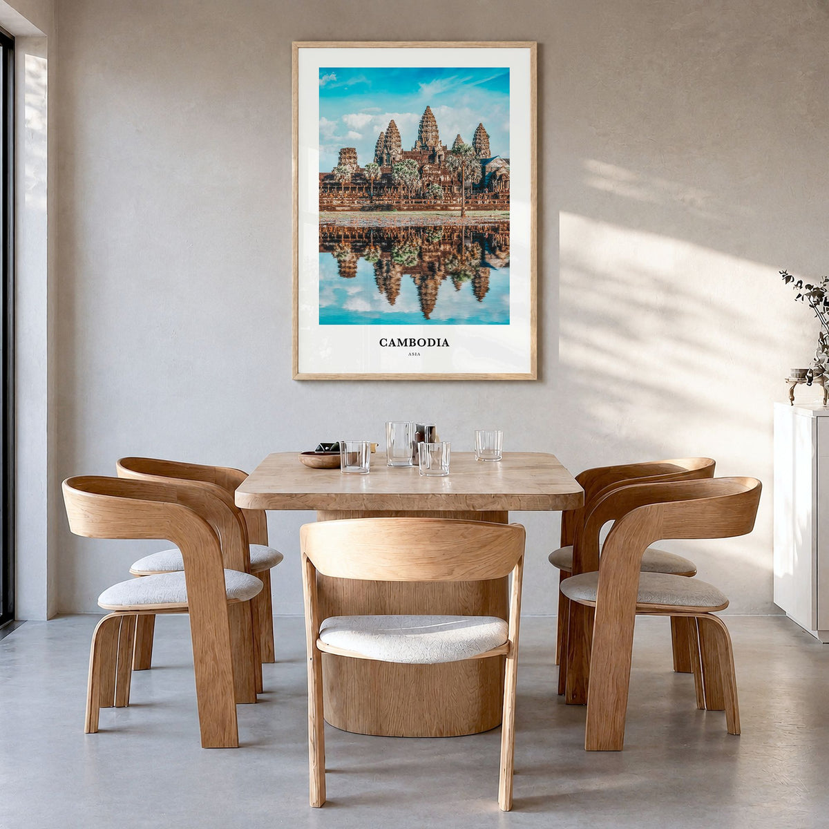 Cambodia Classic Poster in a natural wood frame, hanging in a dining room