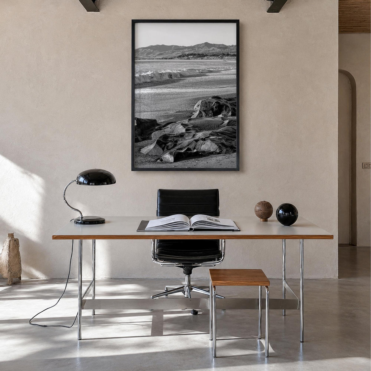 Cambria black & white photo poster of California, USA – vertical wall art in black wood frame, hanging on wall