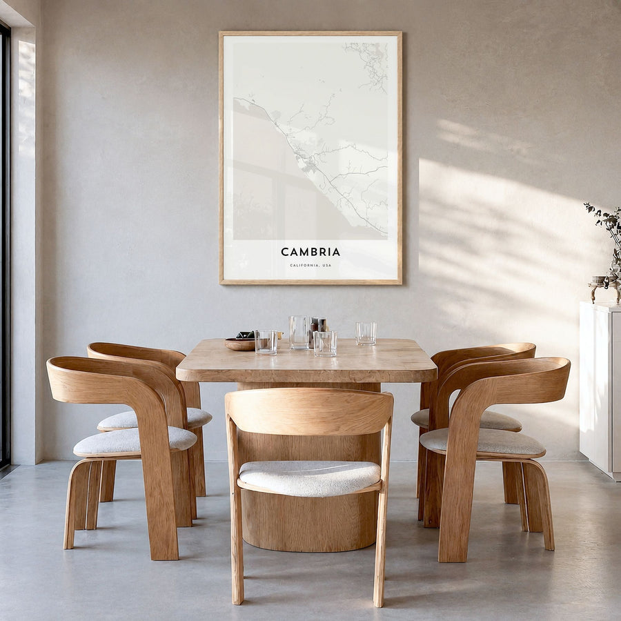 Cambria Map Poster in a natural wood frame, hanging in a dining room