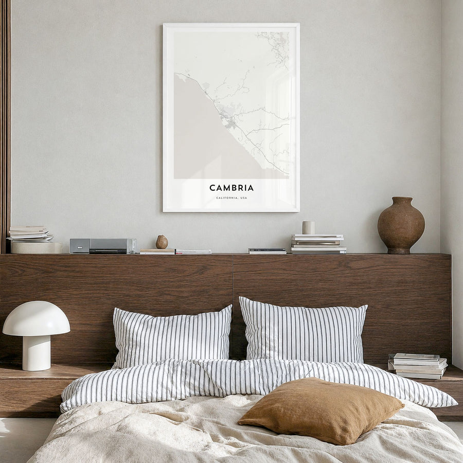 Cambria Map Poster in a white wood frame, hanging in a bedroom