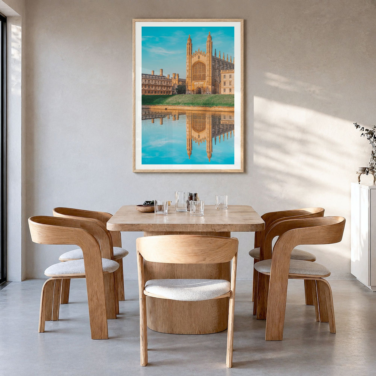 Cambridge, England Photo Poster in a natural wood frame, hanging in a dining room, white border
