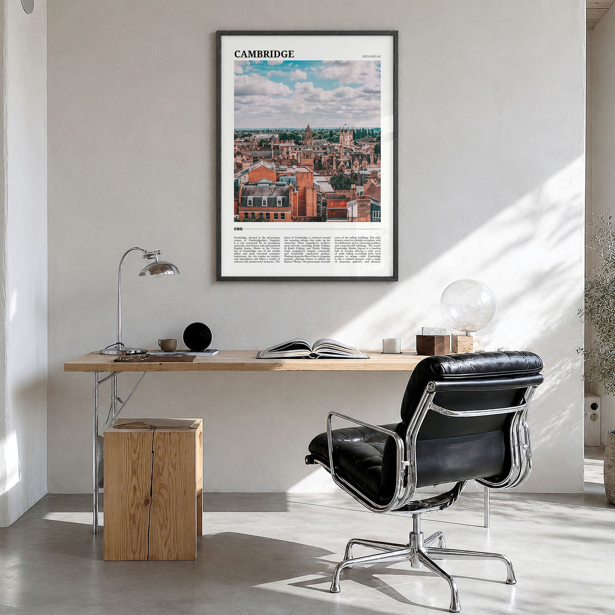 Cambridge, England Travel Poster in a black wood frame, hanging in a bright home office