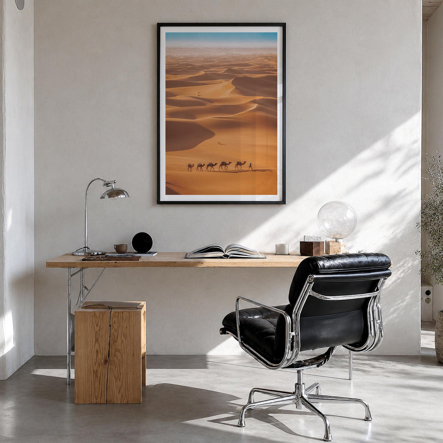 Camel Caravan colorful photo poster – vertical wall art in black wood frame with white border, hanging on wall