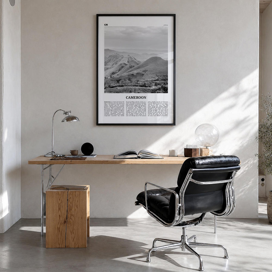 Cameroon black & white newspaper poster of Africa – vertical wall art in black wood frame, hanging on wall