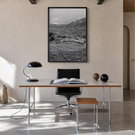 Cameroon black & white photo poster of Africa – vertical wall art in black wood frame, hanging on wall