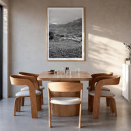 Cameroon black & white photo poster of Africa – vertical wall art in natural wood frame with white border, hanging on wall