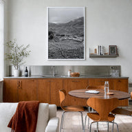 Cameroon black & white photo poster of Africa – vertical wall art in white wood frame, hanging on wall