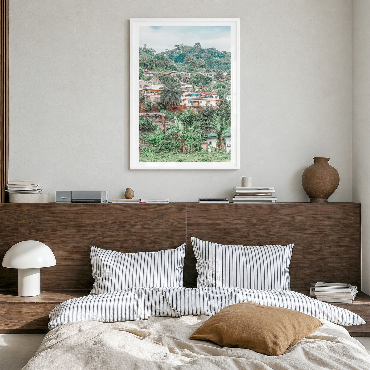 Cameroon Photo Poster in a white wood frame, hanging in a bedroom, white border