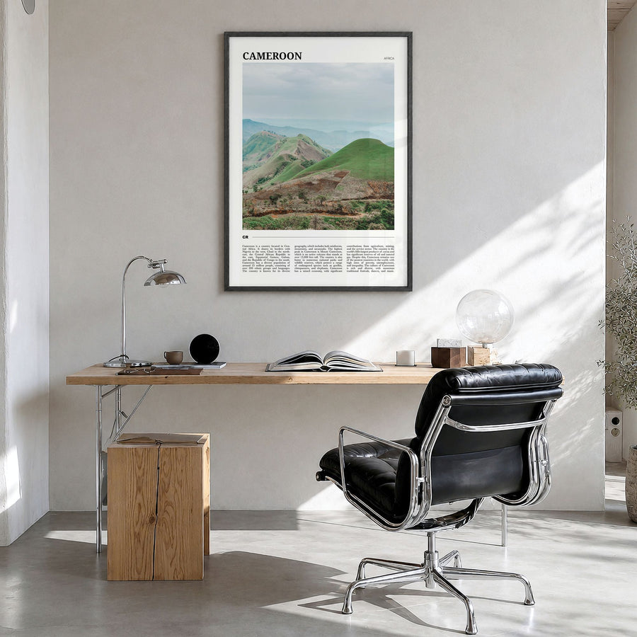 Cameroon Travel Poster in a black wood frame, hanging in a bright home office
