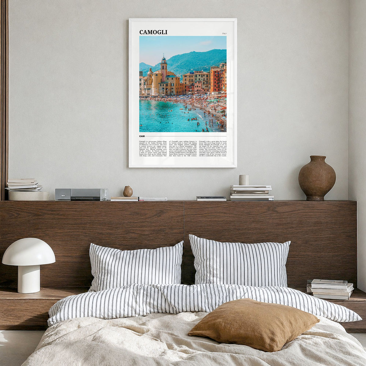 Camogli Travel Poster in a white wood frame, hanging in a bedroom