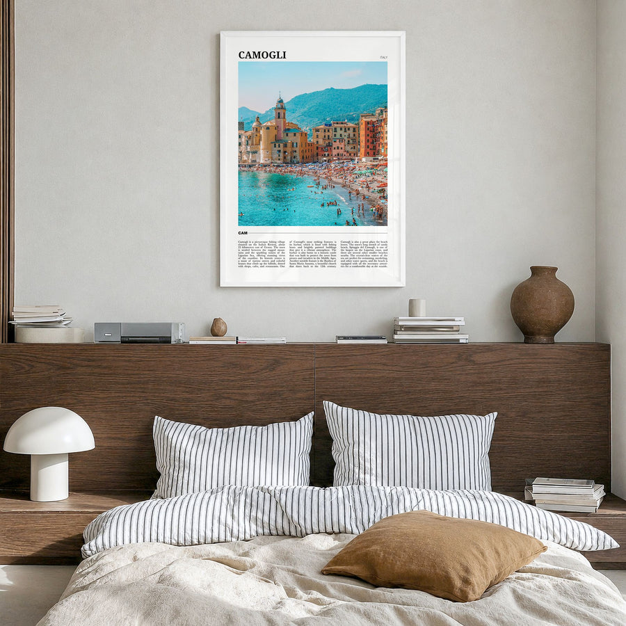 Camogli Travel Poster in a white wood frame, hanging in a bedroom