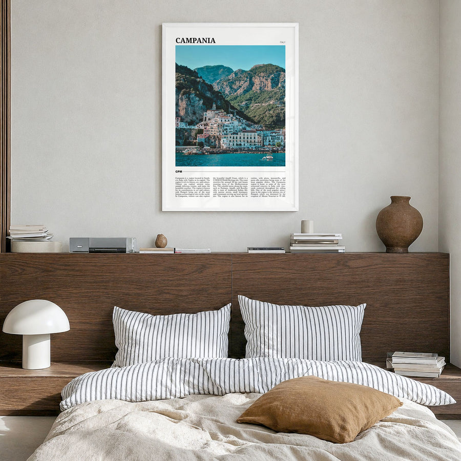 Campania Travel Poster in a white wood frame, hanging in a bedroom