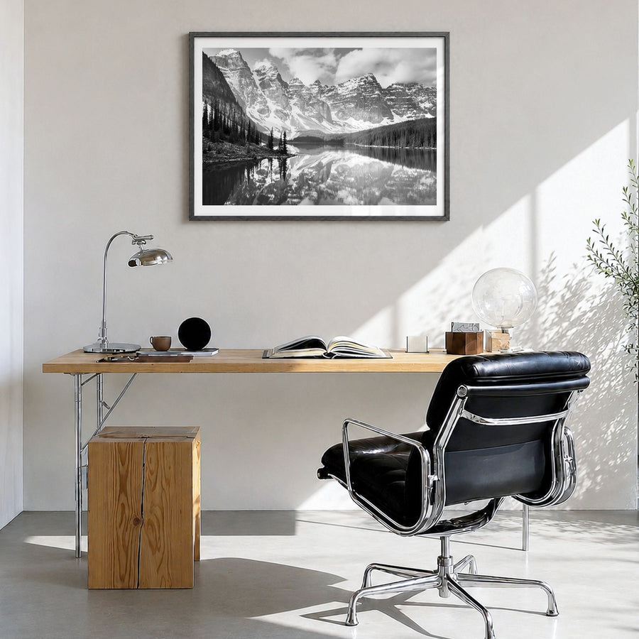 Canada Photo Poster in a black wood frame, hanging in a bright home office, white border