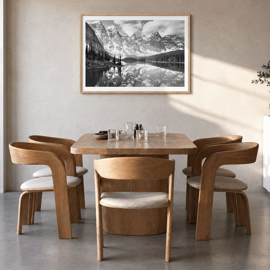 Canada Photo Poster in a natural wood frame, hanging in a dining room, white border