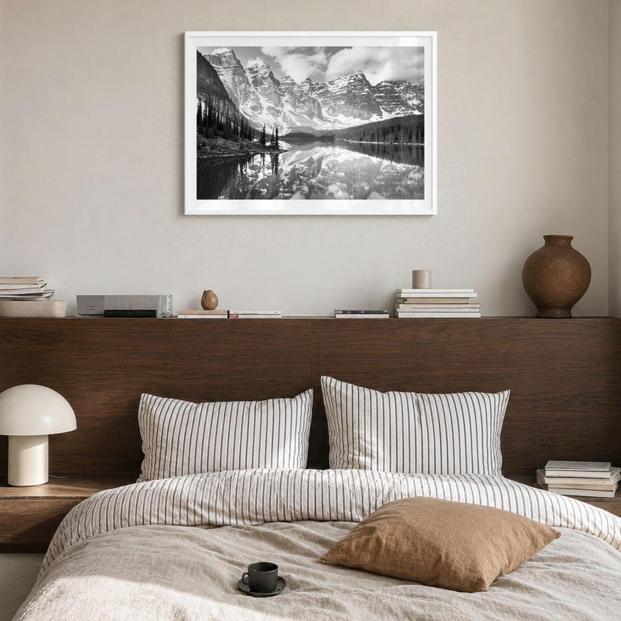 Canada Photo Poster in a white wood frame, hanging in a bedroom, white border