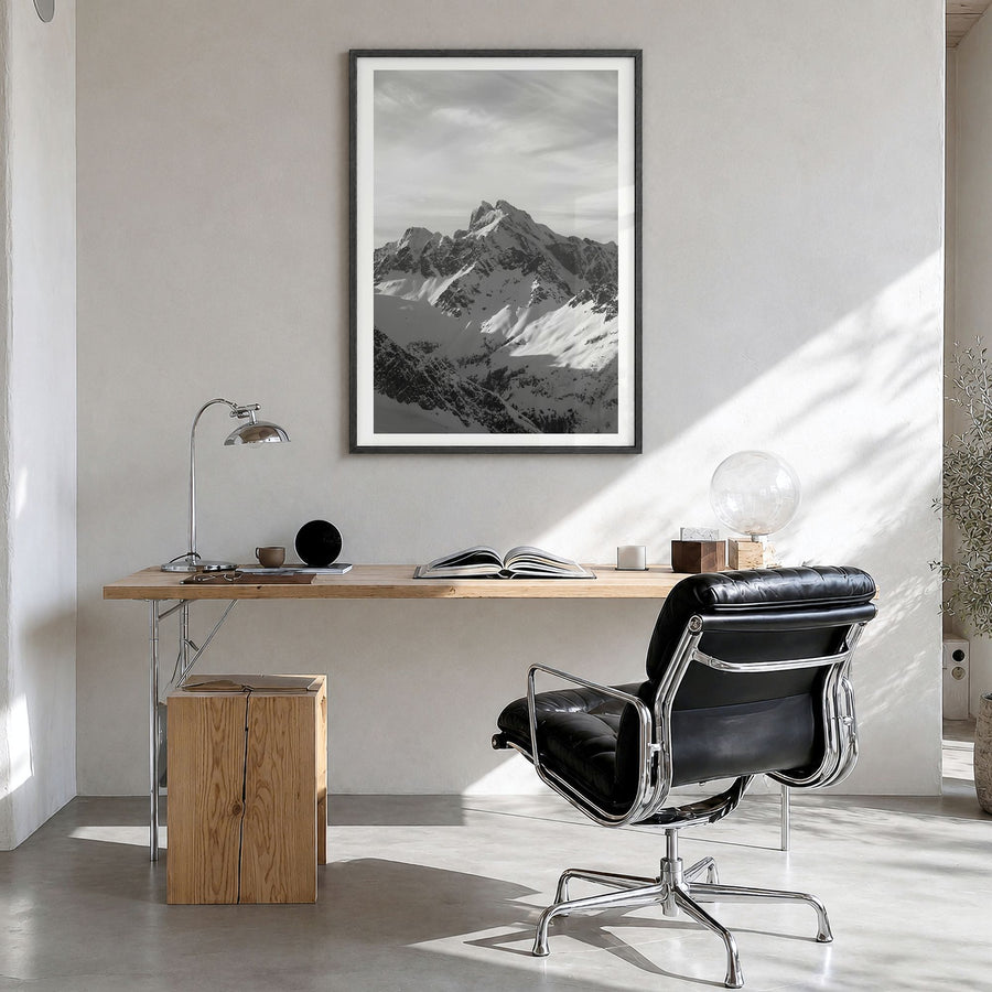 Canada Photo Poster in a black wood frame, hanging in a bright home office, white border